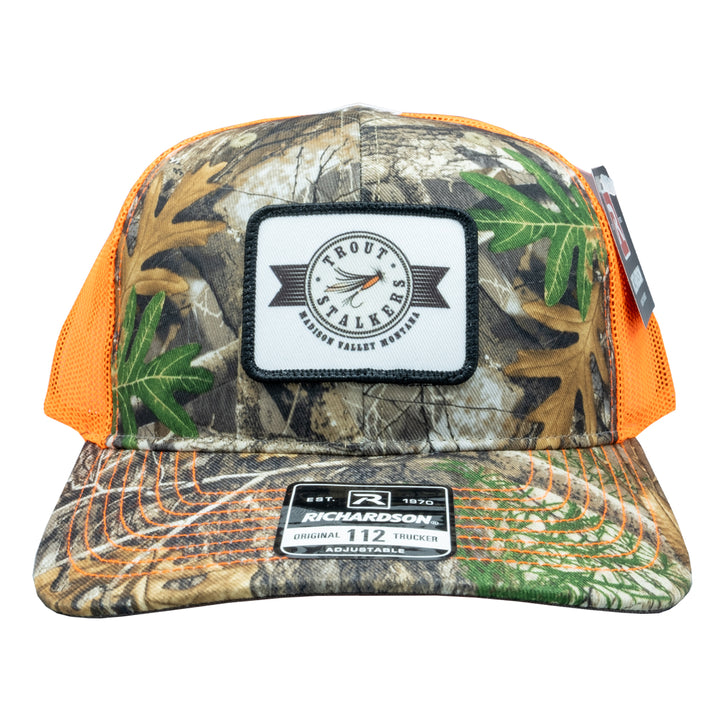 MTS Stamp Logo 112 Realtree Edge/Neon Orange Trucker